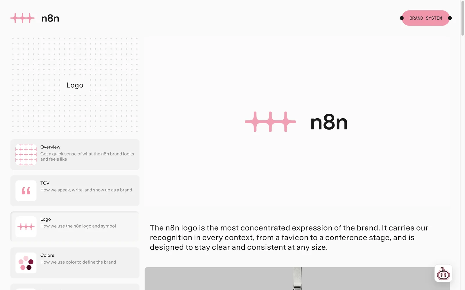 n8n 가이드 사이트 Logo 페이지. 핑크 심볼과 n8n 워드마크